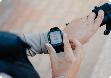 Person activating the Hyfe CoughMonitor wearable